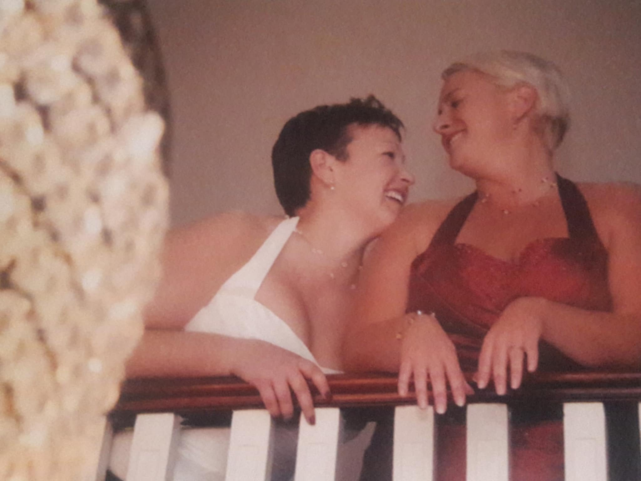 Couple smiling at each other in a warm, candid moment