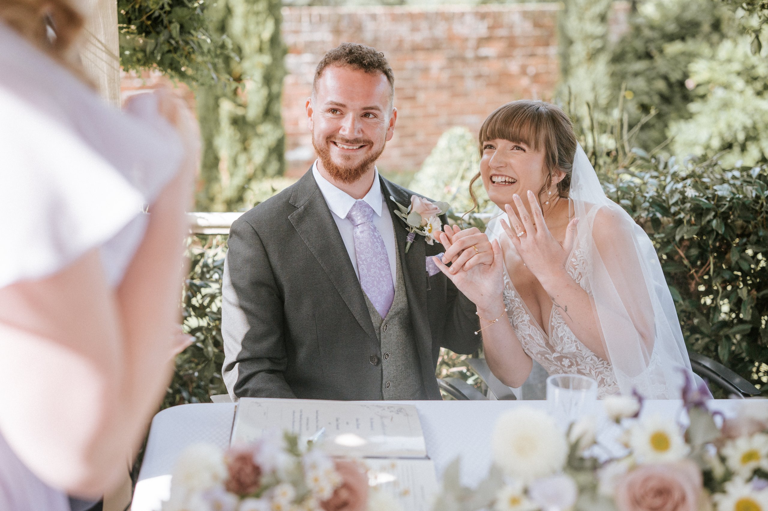 Joyful couple smiling during their reception