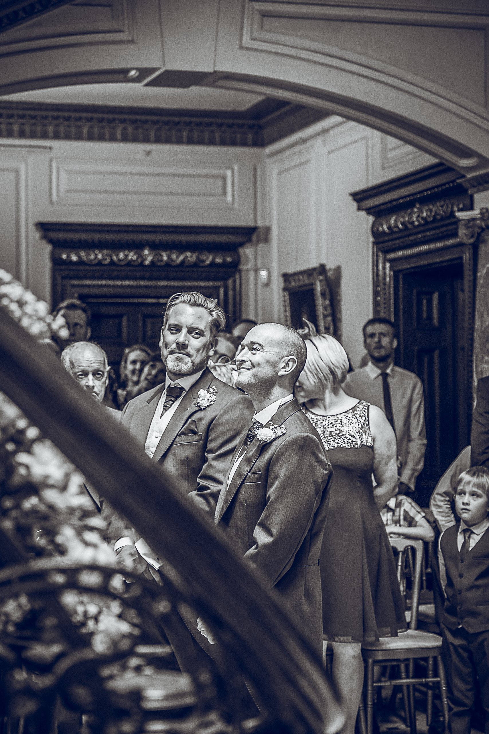 Grooms standing together during their ceremony