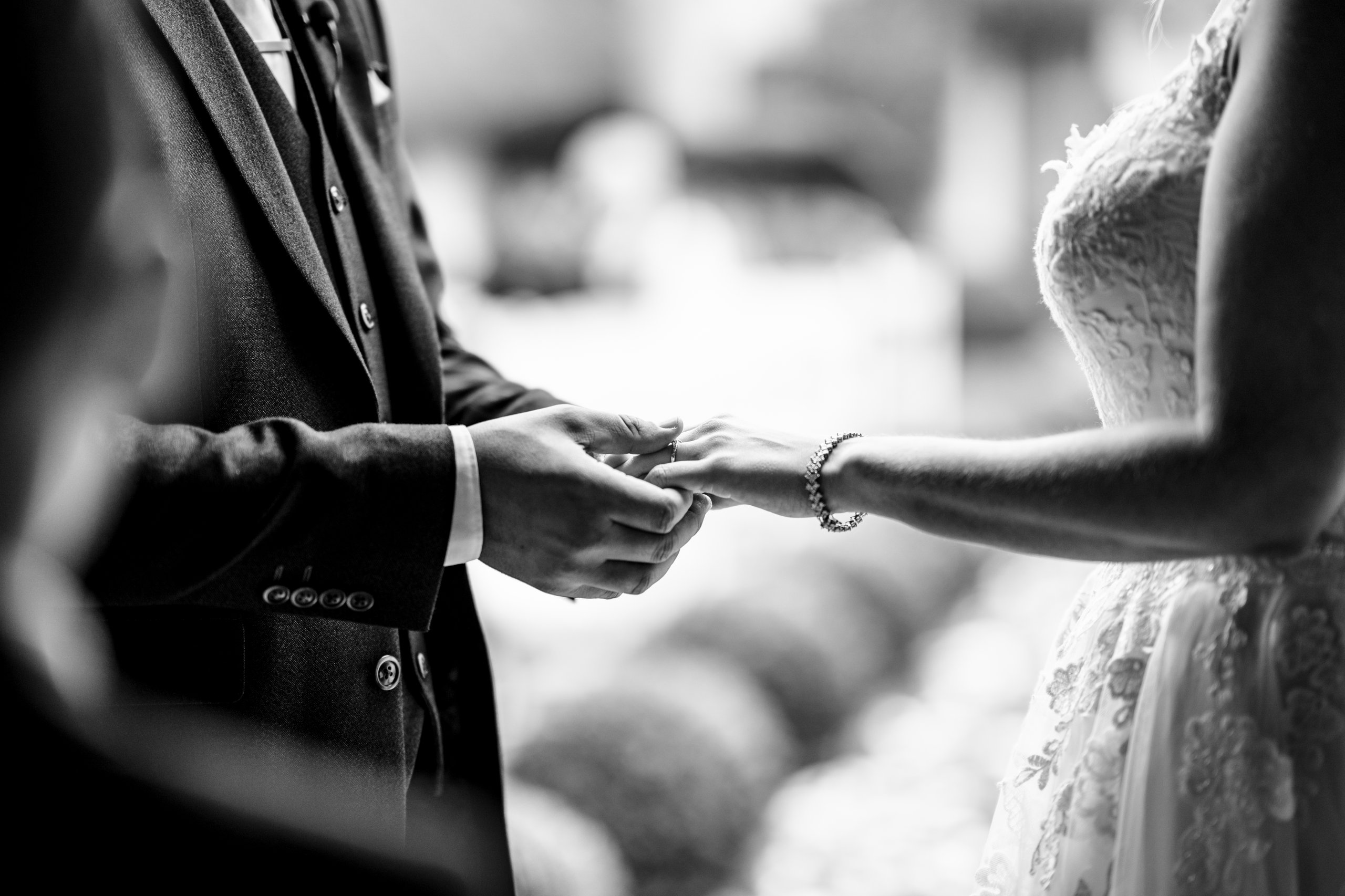 Couple exchanging rings during wedding ceremony